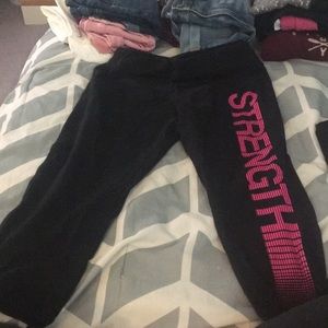 Tek gear leggings that say strength in pink